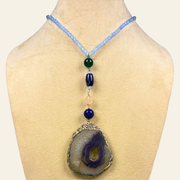 Blue Haven blends the protective strength of black onyx, the intuitive depth of lapis lazuli, and the serene grounding energy of blue agate.