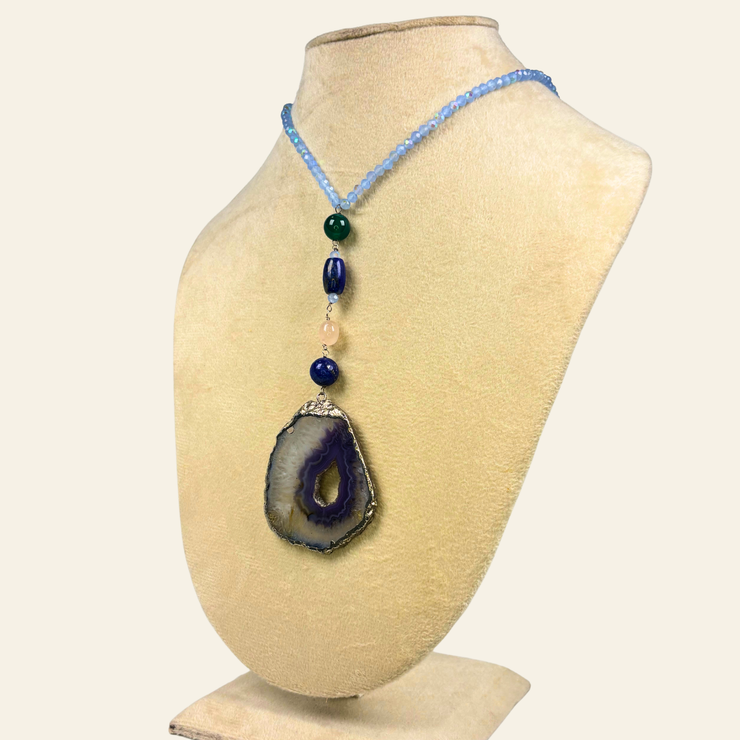 Blue Haven blends the protective strength of black onyx, the intuitive depth of lapis lazuli, and the serene grounding energy of blue agate.